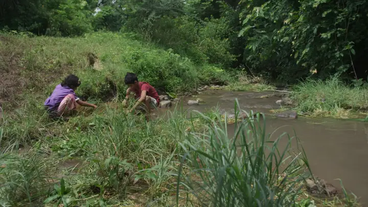 Still from A River Colored Red